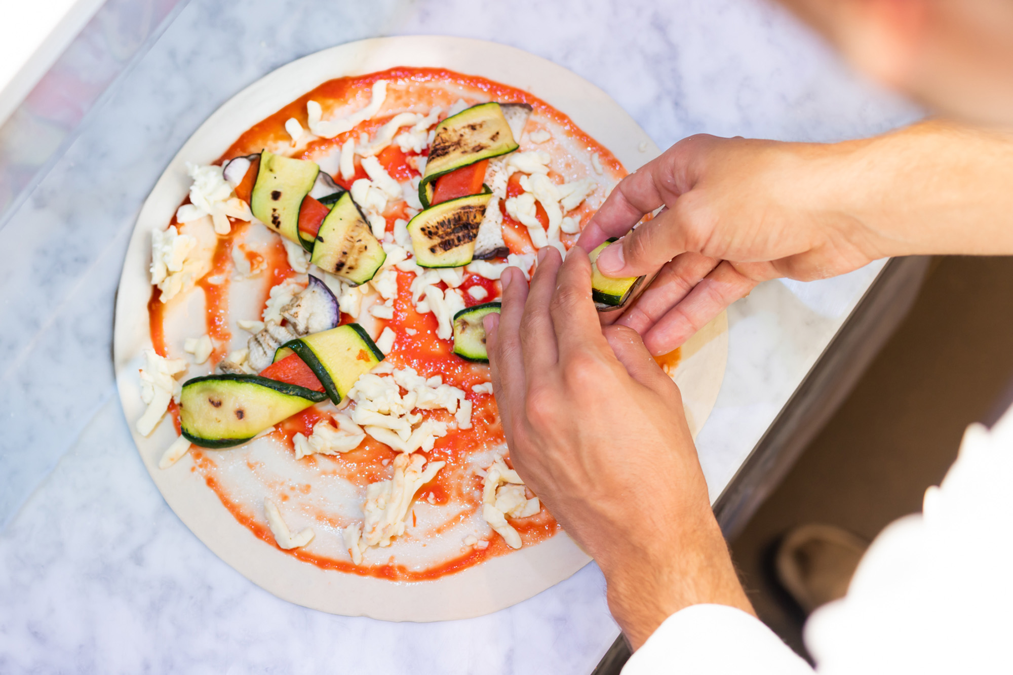 Freshly prepared pizza.